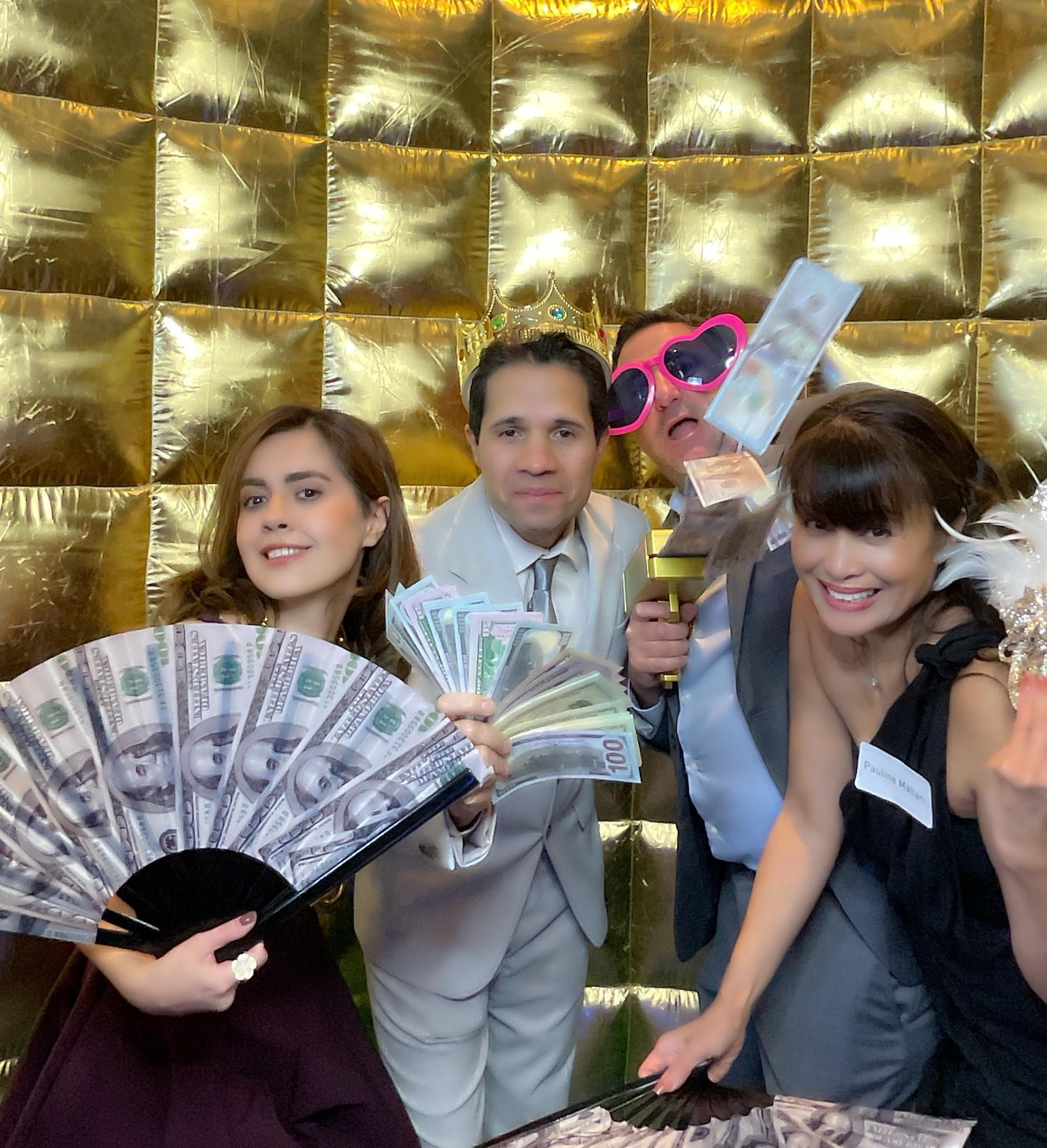 Photo booth event with gold backdrop